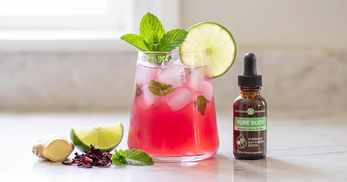 Hibiscus mojito detox mocktail with Pure Body bottle and ingredients